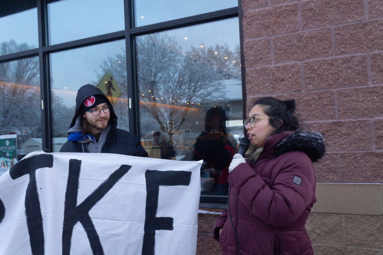 Graciela Nira, Starbucks barista, leads a chant at a strike in St. Paul, Minnesota. 