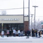 Starbucks workers on strike on outside of a shop in St. Paul, Minnesota.