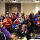 Unions members cheering in a crowd at the "What Could We Win Together" event on October 7.