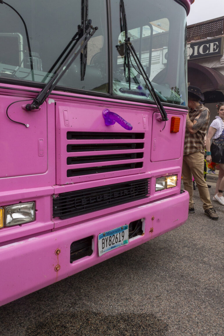 A hot pink truck with a purple sex toy attached trailed the parade, offering a cool, dry place for marchers to take a break and help block traffic.