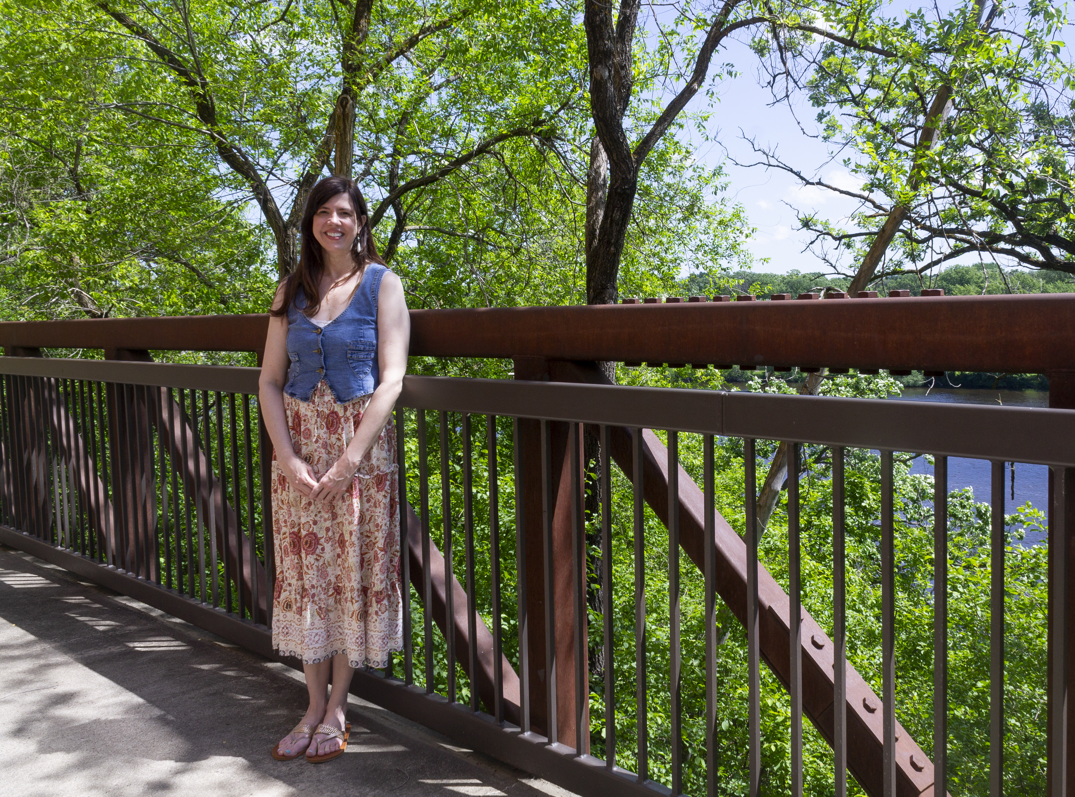 Faith Ericson, a contingent faculty for the past 16 years, poses on the St. Cloud State University campus in front of the Mississippi River in St. Cloud, Minn. 