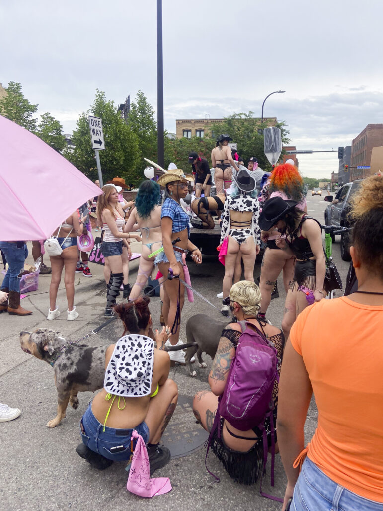 The parade was joyful and celebratory in its tone, while also demanding decriminalization of sex work. Marchers held pink umbrellas that read “Decrim MN.”  