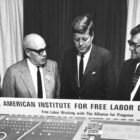 President John F. Kennedy is shown a model for AIFLD’s Mexico City housing project in November 1963. Upon its completion the following year, the project was named the John F. Kennedy Memorial Housing Project in honor of the assassinated president. From left: AIFLD Social Projects director William Doherty Jr.; George Meany; Kennedy; and project supervisor Andrew Klay.