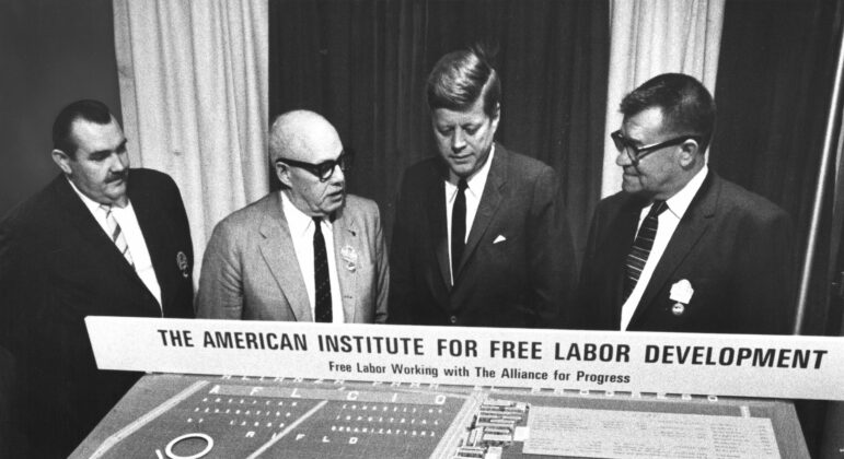 President John F. Kennedy is shown a model for AIFLD’s Mexico City housing project in November 1963. Upon its completion the following year, the project was named the John F. Kennedy Memorial Housing Project in honor of the assassinated president. From left: AIFLD Social Projects director William Doherty Jr.; George Meany; Kennedy; and project supervisor Andrew Klay.