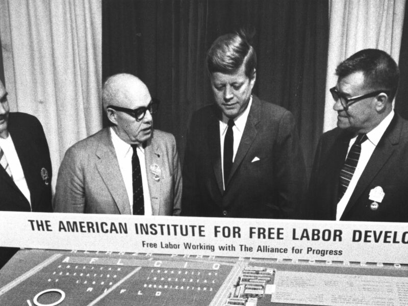 President John F. Kennedy is shown a model for AIFLD’s Mexico City housing project in November 1963. Upon its completion the following year, the project was named the John F. Kennedy Memorial Housing Project in honor of the assassinated president. From left: AIFLD Social Projects director William Doherty Jr.; George Meany; Kennedy; and project supervisor Andrew Klay.