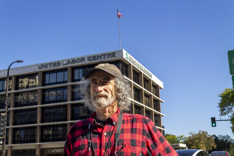 Steve Share poses for a photo in front of the United Labor Center in Minneapolis.