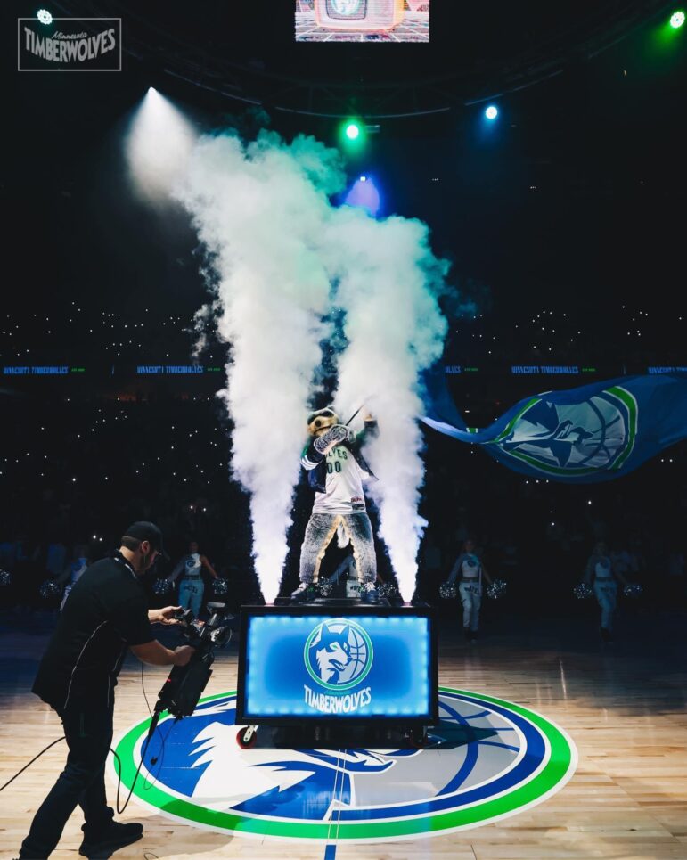 An in-house audio visual camera operator on the job at a Minnesota Timberwolves home game at the Target Center in Minneapolis.