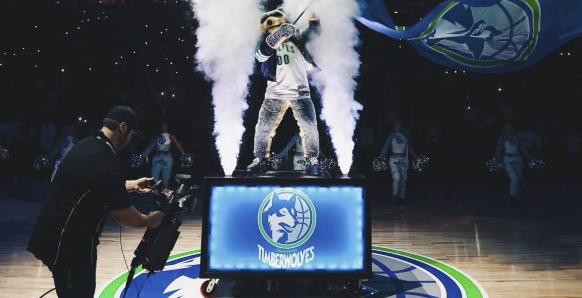 An in-house audio-visual camera operator on the job at a Minnesota Timberwolves home game at the Target Center in Minneapolis.