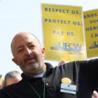 Ryan Christensen, a grocery store worker at Lunds & Byerlys for the past 38 years at a rally.