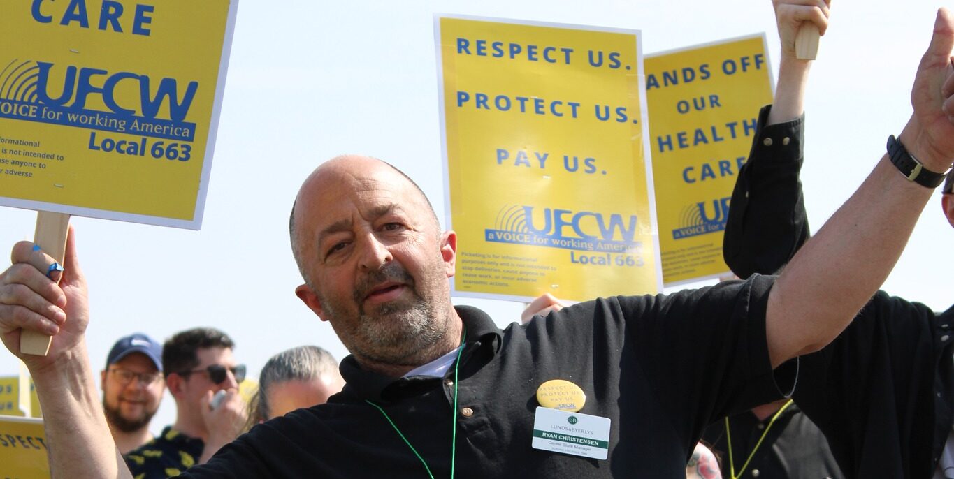 Ryan Christensen, a grocery store worker at Lunds & Byerlys for the past 38 years at a rally.