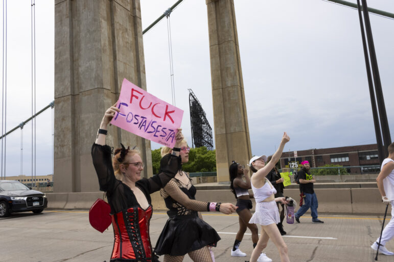 A marcher holds up a sign that reads, “Fuck SESTA/FOSTA”, referencing the 2018 legislative bill “Fight Online Sex Trafficking Act and the Stop Enabling Sex Traffickers Act” that many sex workers and advocates criticize for its infringement on freedom of speech and expression and further pushing sex worker to operate in the shadows with less protections.