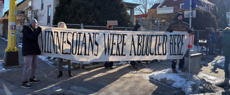 On the corner of Bloomington and 31st Street in South Minneapolis, workers with Metro Transit and allies held up a sign that read, “Minnesotans were abducted here.
