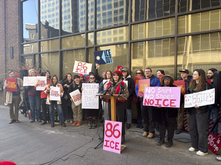 Restaurant workers rally outside the Minnesota Hospitality building in downtown Minneapolis.