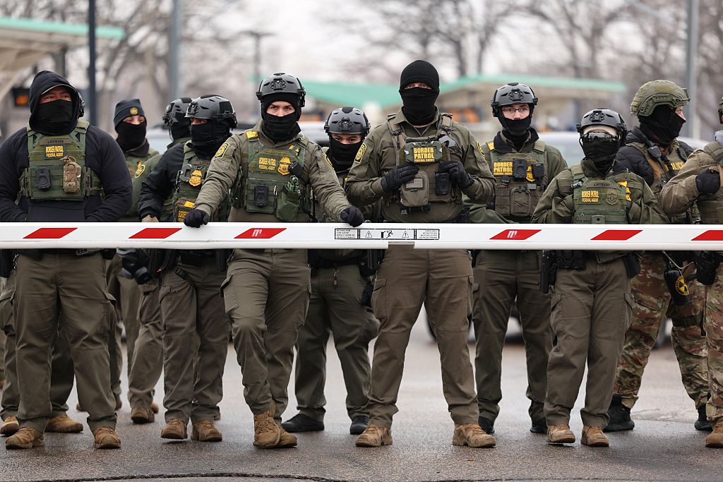 ICE and Border patrol stand in a line.